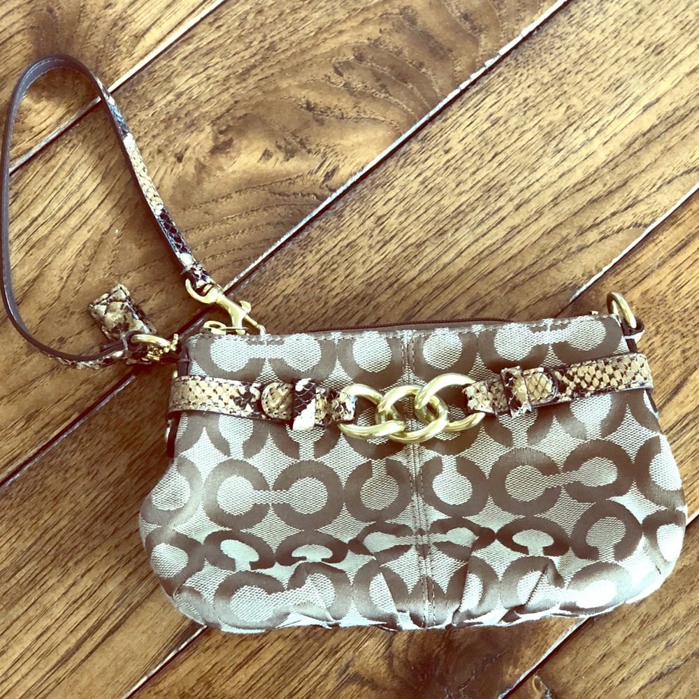 Medium classic design Coach wristlet. New